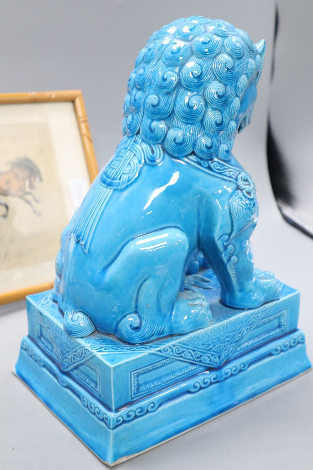 A turquoise glazed dog of fo, height 37cm and a silkwork